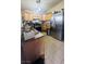 Bright kitchen with wood cabinets and stainless steel appliances at 1825 Ann Greta Dr, Las Vegas, NV 89108