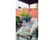 Relaxing patio with covered seating area and potted plants at 1825 Ann Greta Dr, Las Vegas, NV 89108