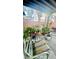 Covered patio with comfortable seating and lush landscaping at 1825 Ann Greta Dr, Las Vegas, NV 89108