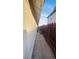 Sidewalk alongside house with wooden fence and string lights at 1825 Ann Greta Dr, Las Vegas, NV 89108