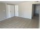 Bright living room featuring a tile floor and neutral walls providing a flexible space at 1901 Belmont St, North Las Vegas, NV 89030