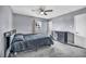 Comfortable bedroom with a ceiling fan, window, plush carpet, and a dresser at 2009 Los Altos St, Las Vegas, NV 89102