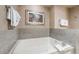 Modern bathtub with stylish tile surround and neutral color palette at 211 E Flamingo Rd # 412, Las Vegas, NV 89169