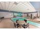 Bright indoor pool area with tables and chairs, with a Las Vegas-themed mural on the wall at 211 E Flamingo Rd # 412, Las Vegas, NV 89169