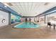 Bright indoor pool area with tables and chairs, with a Las Vegas-themed mural on the wall at 211 E Flamingo Rd # 412, Las Vegas, NV 89169