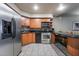 Well-lit kitchen featuring stainless steel appliances, modern cabinets and tile flooring at 211 E Flamingo Rd # 412, Las Vegas, NV 89169