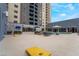 Spacious pool deck with lounge chairs and tables, perfect for relaxing and enjoying the outdoors at 211 E Flamingo Rd # 412, Las Vegas, NV 89169
