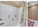 Bathroom with shower/tub combo and updated flooring at 2410 Doherty Way, Henderson, NV 89014