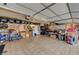 Large garage with ample storage and workbenches at 2410 Doherty Way, Henderson, NV 89014