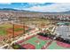 Aerial view of community amenities including baseball field, pool, basketball court and neighborhood at 2436 Padulle Pl, Henderson, NV 89044