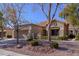 Single-story home with attached garage and landscaped yard at 2437 Desert Butte Dr, Las Vegas, NV 89134