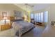 Large bedroom with a comfortable bed, window seat, and wood furniture at 2437 Desert Butte Dr, Las Vegas, NV 89134