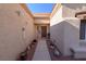 Exterior walkway leading to the front door, framed by desert landscaping at 2437 Desert Butte Dr, Las Vegas, NV 89134