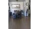 Bright dining room features an table with a bench, a sun painting, plants, and hard wood flooring at 2606 S Durango Dr # 279, Las Vegas, NV 89117