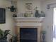 Elegant fireplace mantel adorned with plants and decorative accents at 2606 S Durango Dr # 279, Las Vegas, NV 89117