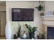 Living room featuring decor, a fireplace, and a wall-mounted television at 2606 S Durango Dr # 279, Las Vegas, NV 89117