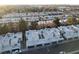 Aerial view of modern townhome community with palm trees, garages, and street parking at 2638 Aracatuba Ave, Las Vegas, NV 89121