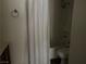 Bathroom features a shower and tub combo and toilet at 2638 Aracatuba Ave, Las Vegas, NV 89121