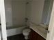 A bathroom features a white tub, toilet, vanity, and mirror at 2638 Aracatuba Ave, Las Vegas, NV 89121
