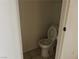 Functional bathroom featuring a standard toilet and tiled floors at 2638 Aracatuba Ave, Las Vegas, NV 89121