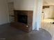 Charming living room showcases brick fireplace with built-in shelves and open layout at 2638 Aracatuba Ave, Las Vegas, NV 89121
