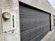 Close-up of a gray garage door with house number at 2638 Aracatuba Ave, Las Vegas, NV 89121