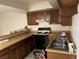 Functional kitchen boasts ample counter space and essential appliances for cooking at 2638 Aracatuba Ave, Las Vegas, NV 89121