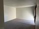 Spacious living room features neutral walls and plush carpeting at 2638 Aracatuba Ave, Las Vegas, NV 89121