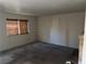 Neutral living room features natural light and brick fireplace, perfect for cozy evenings at 2638 Aracatuba Ave, Las Vegas, NV 89121