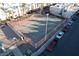 Aerial view of outdoor tennis court with cars parked in the street at 2638 Aracatuba Ave, Las Vegas, NV 89121