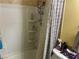 Bathroom with shower stall, tile surround, and updated fixtures at 2663 Aracatuba Ave, Las Vegas, NV 89121