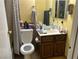 Clean bathroom with single sink vanity, toilet, and shower/tub combo at 2663 Aracatuba Ave, Las Vegas, NV 89121