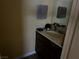 Simple bathroom with vanity, sink, and mirror at 2663 Aracatuba Ave, Las Vegas, NV 89121