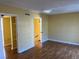 Bedroom with hardwood floors, closet and entry to stairway at 2663 Aracatuba Ave, Las Vegas, NV 89121
