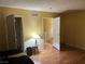Bright bedroom with wood floors and access to a hallway and additional rooms at 2663 Aracatuba Ave, Las Vegas, NV 89121