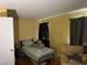 Cozy bedroom with a bed, chair, and window with curtains at 2663 Aracatuba Ave, Las Vegas, NV 89121