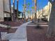 Landscaped community walkway with palm trees at 2663 Aracatuba Ave, Las Vegas, NV 89121