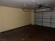 View of the two car garage with overhead door and painted walls at 2663 Aracatuba Ave, Las Vegas, NV 89121