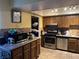 Well-equipped kitchen featuring wood cabinets and granite countertops at 2663 Aracatuba Ave, Las Vegas, NV 89121