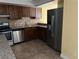Kitchen showcasing stainless steel appliances and plenty of cabinet space at 2663 Aracatuba Ave, Las Vegas, NV 89121