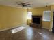 Bright living room with a brick fireplace and ceiling fan at 2663 Aracatuba Ave, Las Vegas, NV 89121