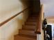 Wooden staircase with simple wooden railing at 2663 Aracatuba Ave, Las Vegas, NV 89121