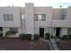 Two story stucco townhouse with parking and surrounding buildings at 2686 Ruthe Duarte Ave, Las Vegas, NV 89121