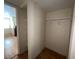 A walk-in closet features wooden floors, white shelves, and hanging rod at 2686 Ruthe Duarte Ave, Las Vegas, NV 89121