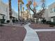 Community walkway surrounded by desert landscaping and palm trees at 2686 Ruthe Duarte Ave, Las Vegas, NV 89121