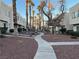 Landscaped community walkway with palm trees and desert landscaping at 2686 Ruthe Duarte Ave, Las Vegas, NV 89121