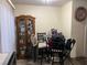 Dining area with round table and chairs near a display cabinet at 2686 Ruthe Duarte Ave, Las Vegas, NV 89121