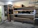 Spacious garage featuring wooden shelves for ample storage and a water heater at 2686 Ruthe Duarte Ave, Las Vegas, NV 89121