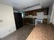 Features a kitchen with dark wood cabinetry, tiled floors, and modern appliances at 2686 Ruthe Duarte Ave, Las Vegas, NV 89121