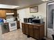 Kitchen with wooden cabinets, stainless steel appliances, and tile floor at 2686 Ruthe Duarte Ave, Las Vegas, NV 89121